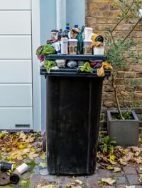 Recyling in trash bin.